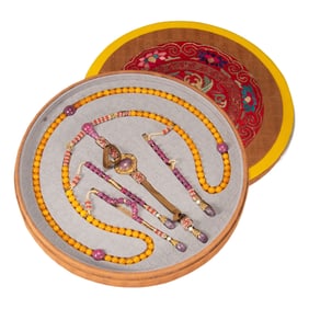 A CHINESE IMPERIAL AMBER ROSARY WITH BOX