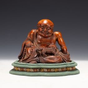 A CHINESE CARVED SEATED LUOHAN