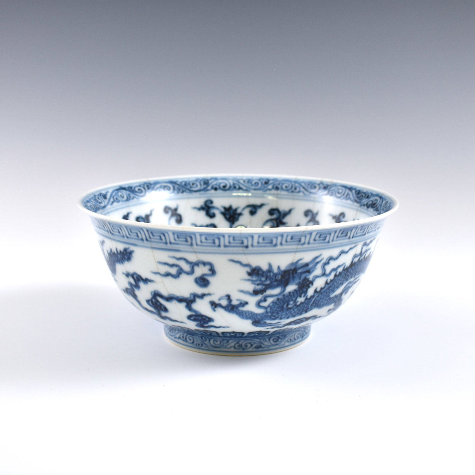 PR. Qing Blue & white dragon plates: Dimensions: 3-1/2" H x 7-7/8" Dia. Chinese Ming Dynasty Period, Xuande blue & white dragon bowl. Potted with a shallow body, slight deep, thick and bulbous body, with angled cavetto elevated the steep