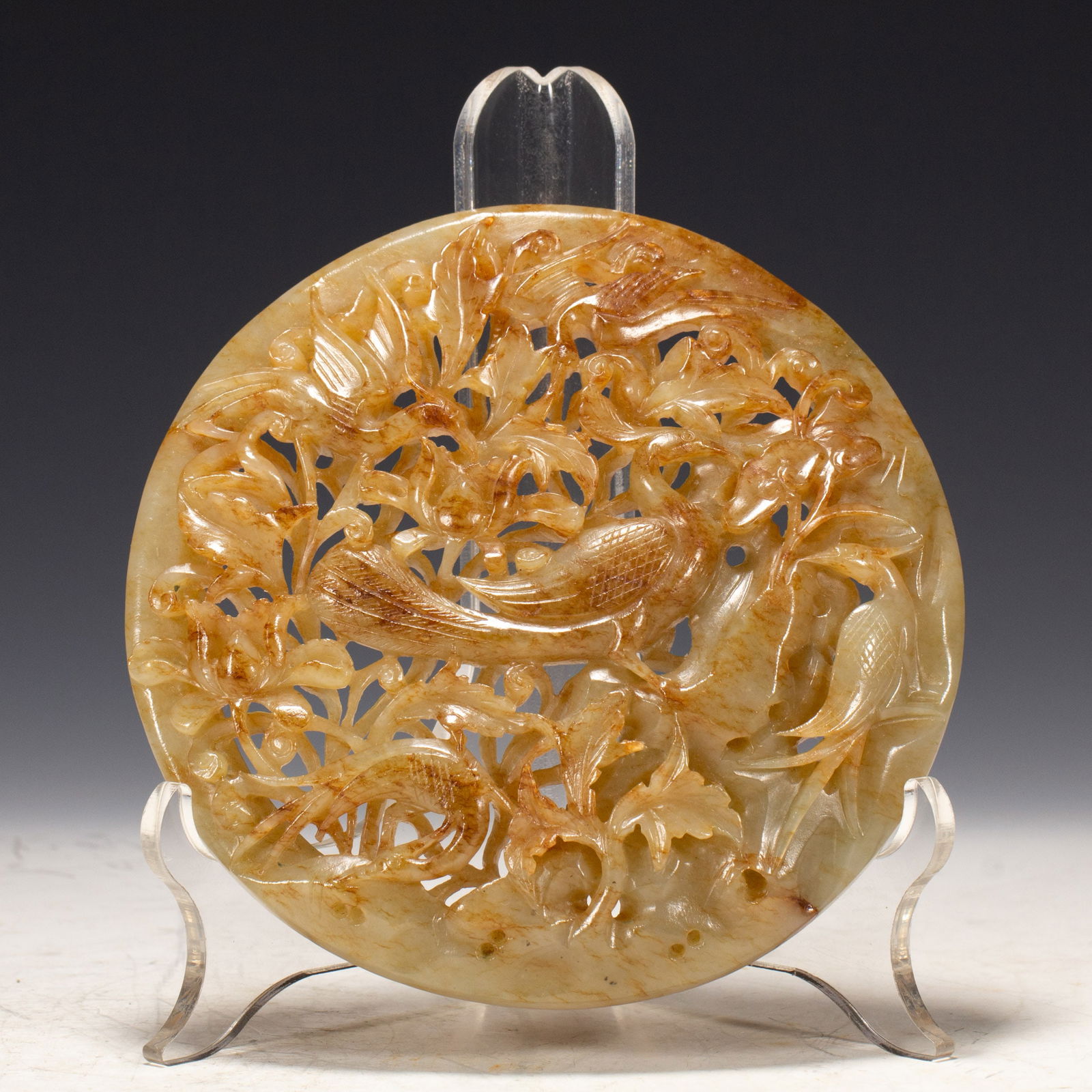 A CHINESE CARVED AND RETICULATED JADE PLAQUE (1 of 10)