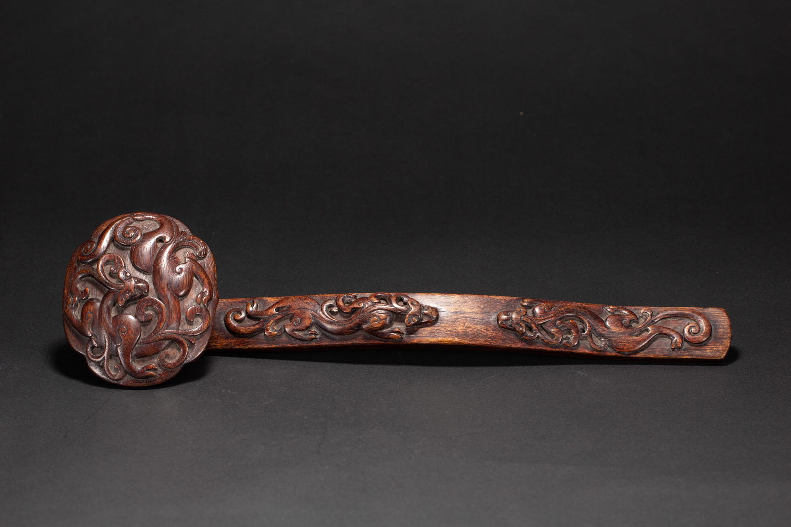 A CHINESE CARVED ALOESWOOD RUYI SCEPTER (1 of 10)