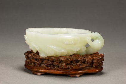 A CHINESE CARVED WHITE JADE CHILONG WASHER