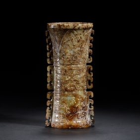 A CHINESE ARCHAISTIC CARVED JADE VASE