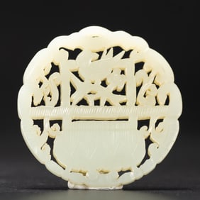 A CARVED WHITE JADE DRAGON PLAQUE