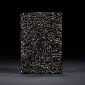 A CARVEFD ROSEWOOD BOX WITH COVER