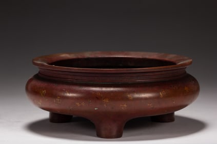 A BRONZE TRIPOD CENSER