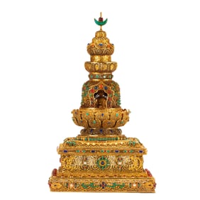 A HARDSTONES INLAID BRONZE-GILT STUPA