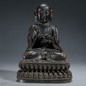 A SINO-TIBETAN BRONZE SHAKYAMUNI