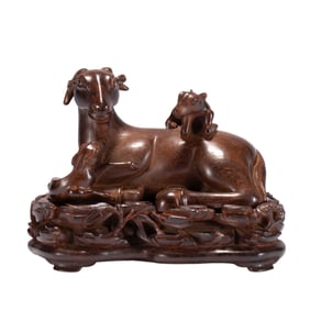 A FINE CARVED HUANGHUALI RAMS DECORATION