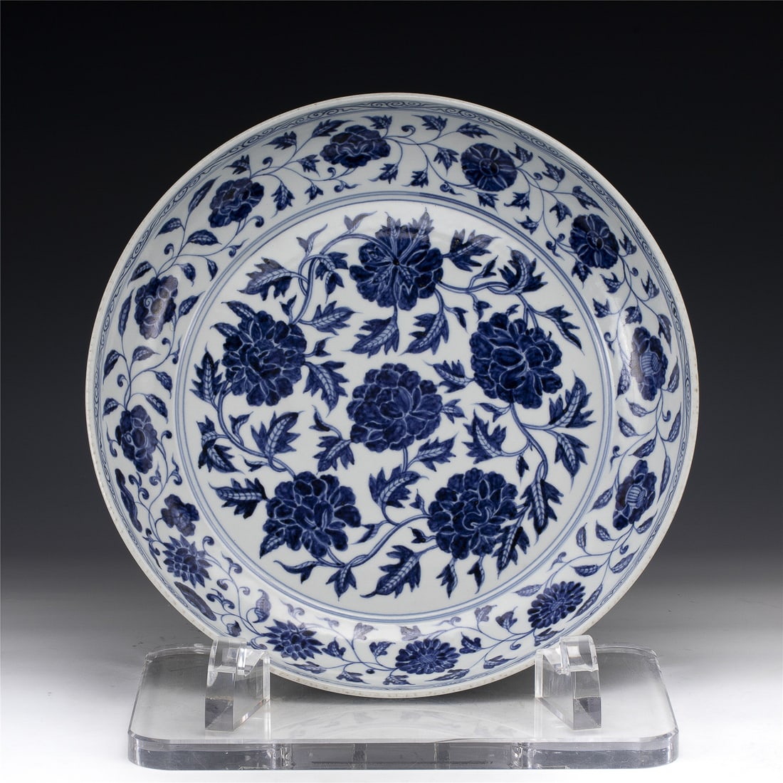 MING BLUE & WHITE DISH PLATE: Measurements: Width: 40.6 cm, Height: 7 cm Chinese Ming Dynasty Blue and White Porcelain Dish Plate. The plate has a broad wide central interior, rounded mouth lip, thick and large, raised on