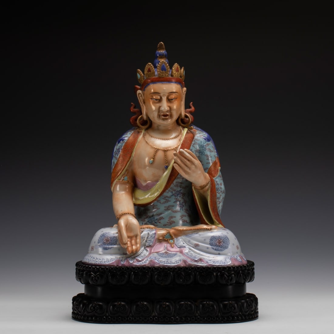 FAMILLE ROSE BUDDHA STATUE: Measurements: Length: 21.5 cm, Width: 16.5 cm, Height: 29.5 cm Chinese Famille Rose Buddha Statue On Carved Hardwood Stand. This statue of Buddha carved with Peaceful, smiling, beautiful and