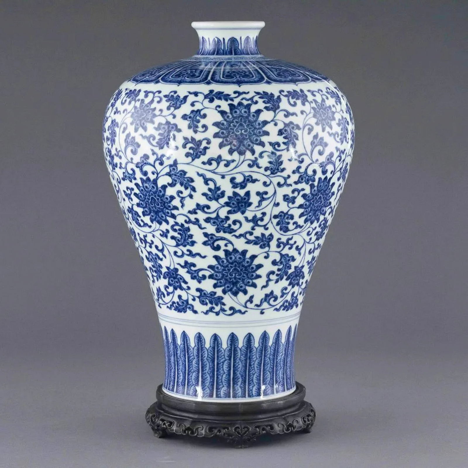 QIANLONG BLUE & WHITE WRAPPED FLORAL MEIPING JAR ON STAND: Measurements: Height: 15.5 inch x Width/Diameter: 9.125 inch x Length/Depth: 9.125 inch Measurements in Centimeter: 39.4 cm x 23.2 cm x 23.2 cm Extraordinary, Chinese Qing Dynasty Qianlong blue &