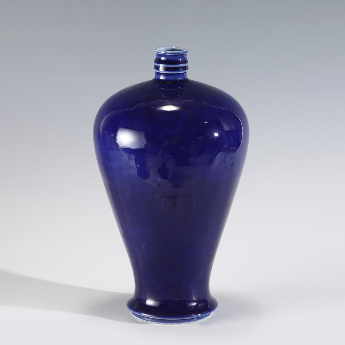 QING QIANLONG JI BLUE MEIPING JAR: Measurements: Height: 30 cm, Diam: 16.8cm Chinese Qing Dynasty Qianlong Ji Blue Glazed Porcelain Meiping Jar. The porcelain potted into a traditional Meiping form, large, thick and tall potted, wide b