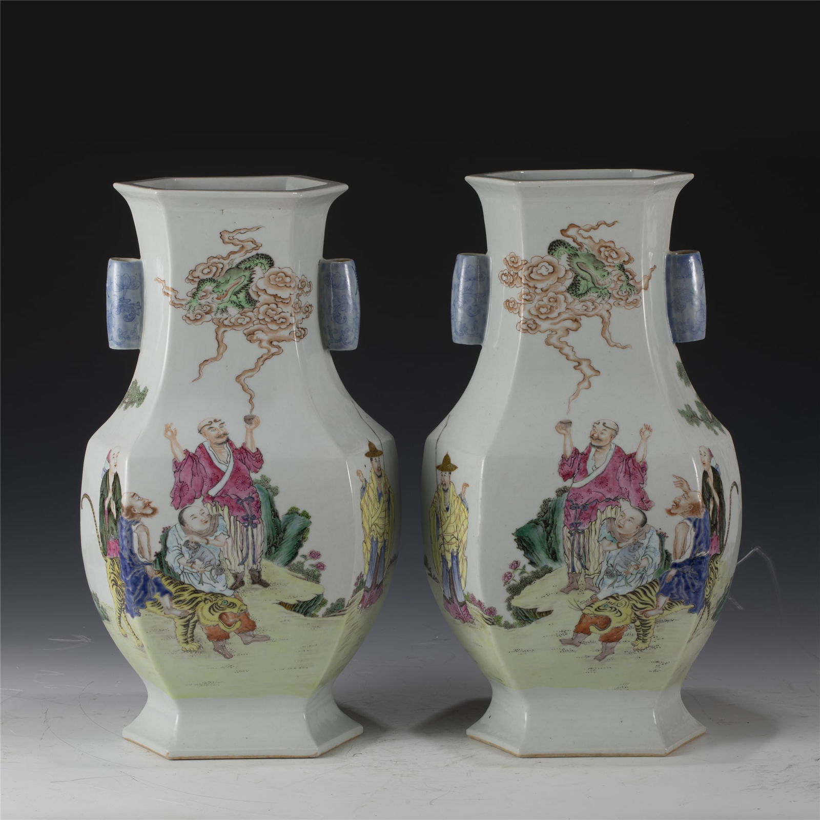 PAIR OF QING QIANLONG FAMILLE ROSE DOUBLE-EARED VASE: Length: 24.4 cm, Width: 18.8 cm, Height: 43cm Pair of Chinese Qing Dynasty Qianlong Famille Rose Porcelain Double-Eared Gourd Hexagonal Vases. Potted in hexagonal shaped vase, thick and large, globula