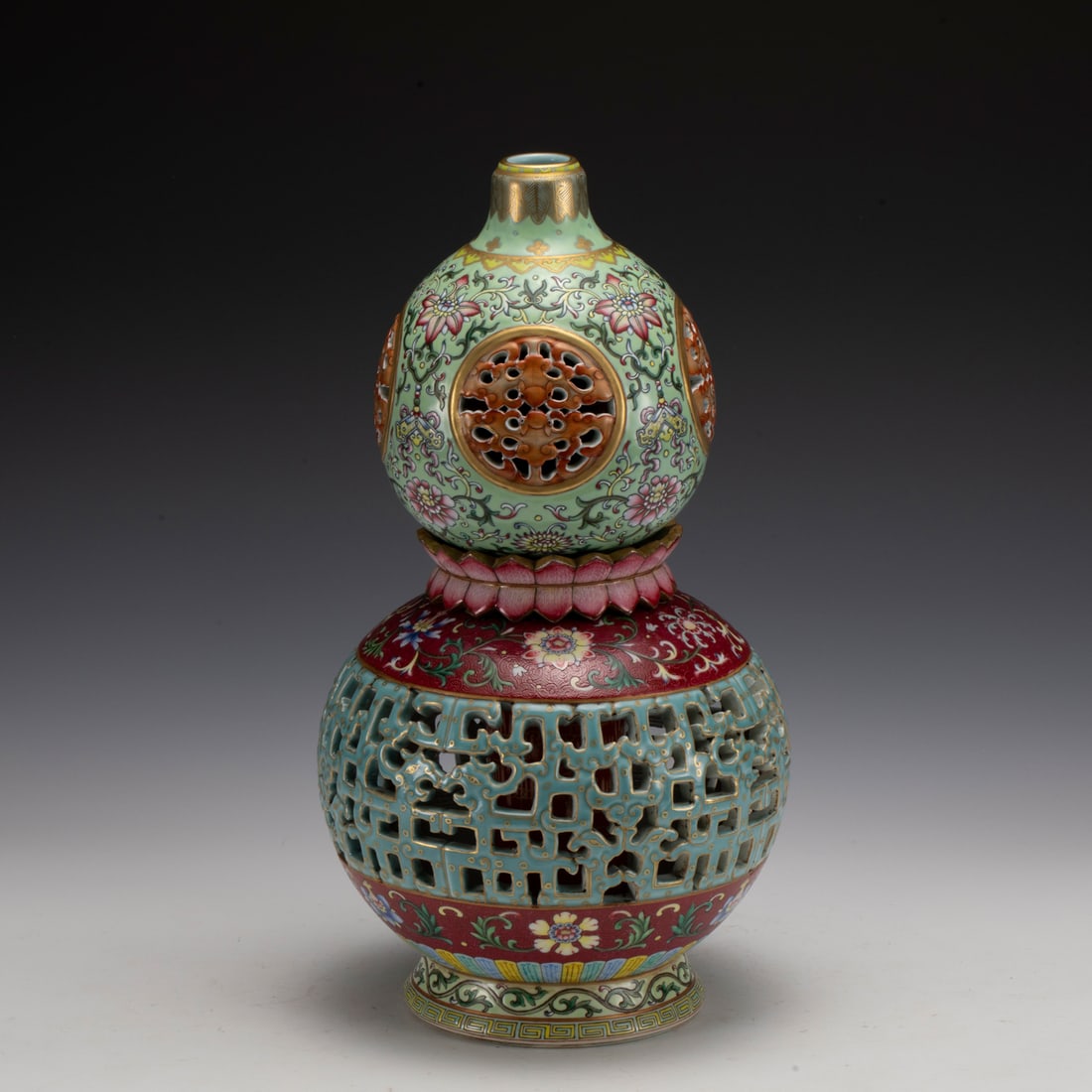 FAMILLE ROSE TURNING HEART GOURD VASE: Measurements: Width: 19 cm, Height: 35 cm Chinese Famille Rose Porcelain Turning Heart Gourd Vase. Potted in a shape of double gourd resemblance, with two bulbous bellies conjoined together, bulbous l