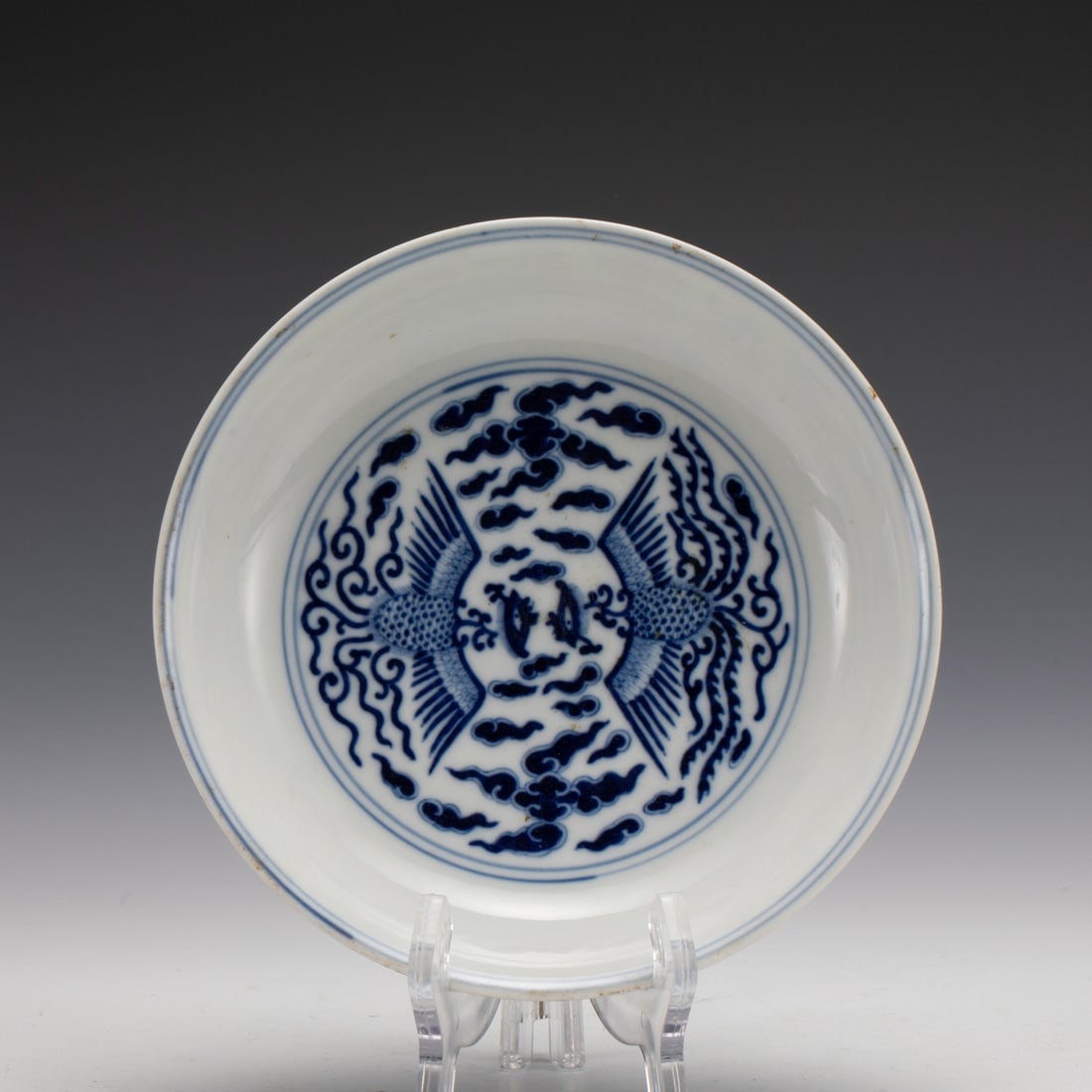 YONGZHENG BLUE & WHITE PHOENIX PLATE: Measurements: Width: 18 cm, Height: 4 cm Chinese Blue and White Phoenix Porcelain Plate. The plate has a broad wide central interior, round mouth lip, thick and large, raised on correspondence