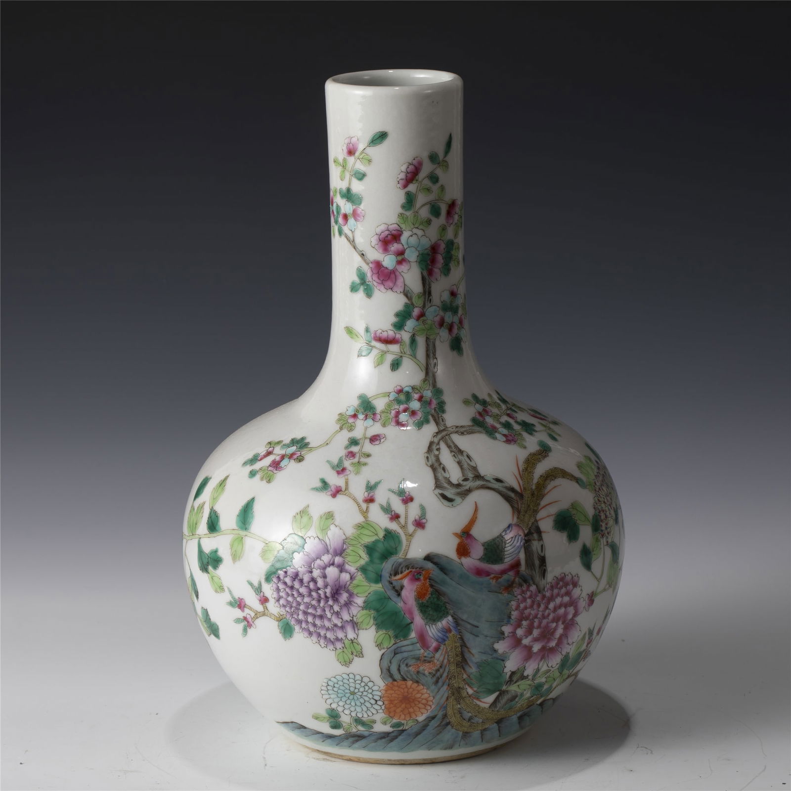 QING QIANLONG FAMILLE ROSE CELESTIAL VASE: Dimensions: 17.7cm L x 17.7cm W x 26.5cm H Chinese Qing Dynasty QianLong Famille Rose Peacock Porcelain Vase. Potted in reward shape vase, thick and tall, globular lower body, cylindrical neck,