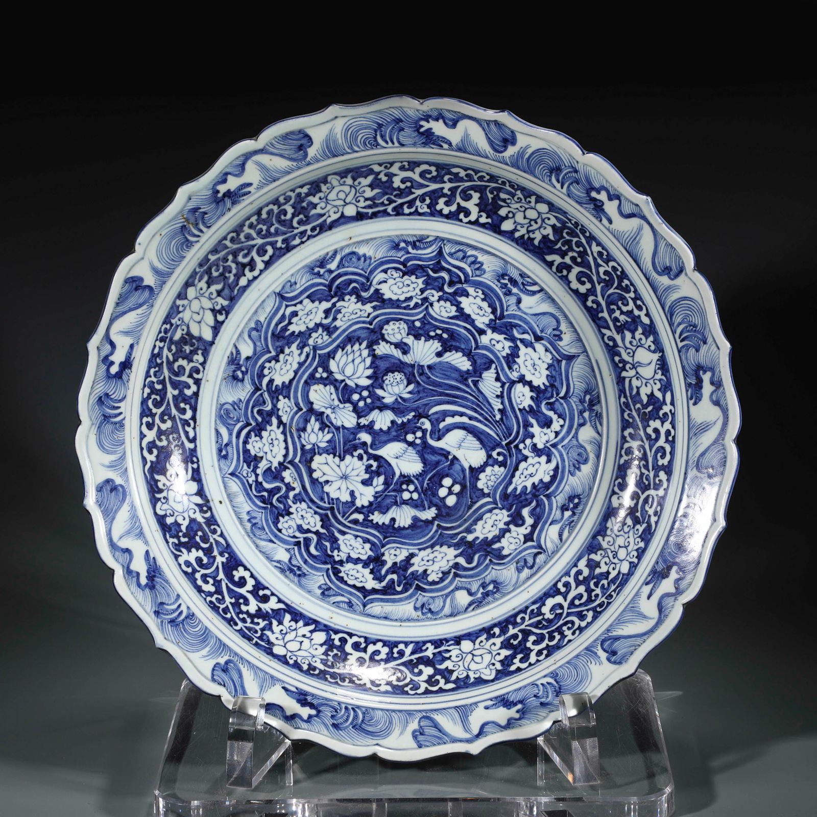 YUAN BLUE & WHITE WRAPPED FLORAL PLATE: Dimensions: Width: 45cm, Height: 8cm Chinese Yuan Dynasty Blue and White Porcelain Plate. The plate has a broad wide central interior, flori rounded mouth lip, thick and large, raised on