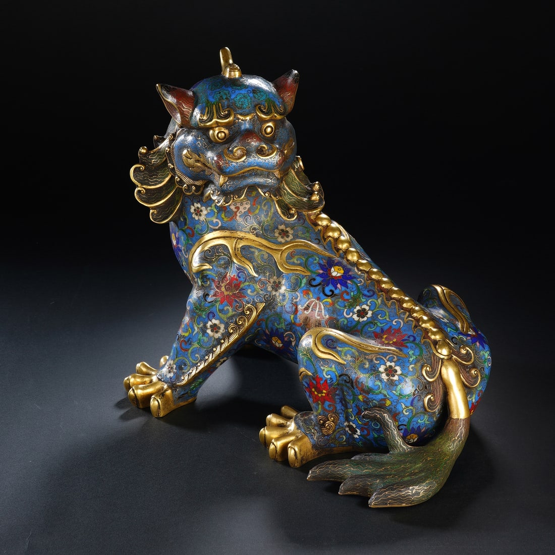 CHINESE CLOISONN? QILIN ORNAMENT: Dimensions: 28x20x27 cm. Weight 6100 grams. This Chinese cloisonn? enamel qilin sculpture features a vibrant blue enamel ground with polychrome floral scrolls and gilt-bronze accents, measuring 28 cm