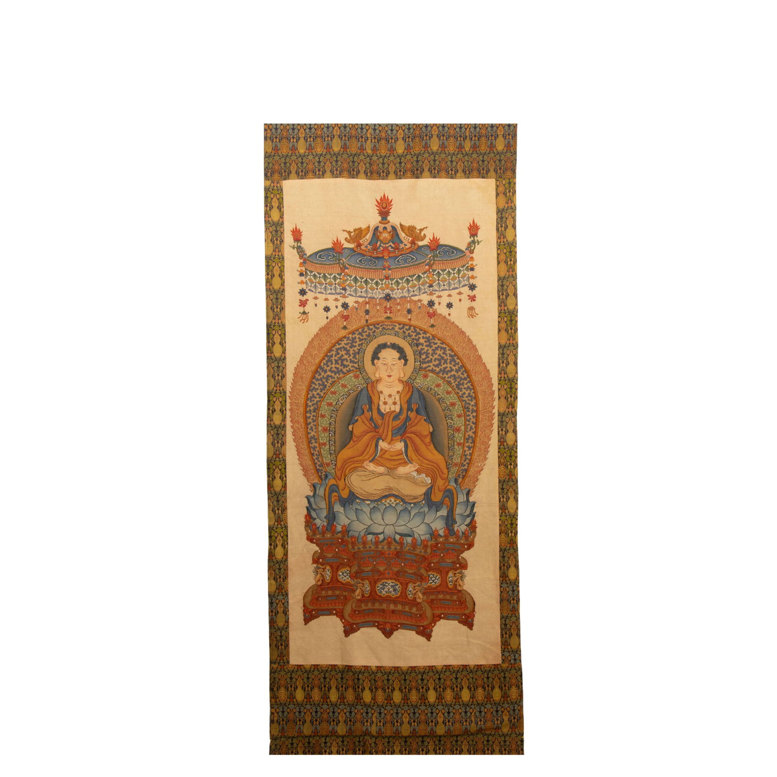 CHINESE KESI SILK BUDDHA THANGKA: Dimensions: L. 260 cm. W. 92 cm. This sublime Chinese kesi (tapestry) silk thangka centers on a seated Buddha figure, rendered with intricate kesi weaving in a rich palette of saffron, cobalt, and gol