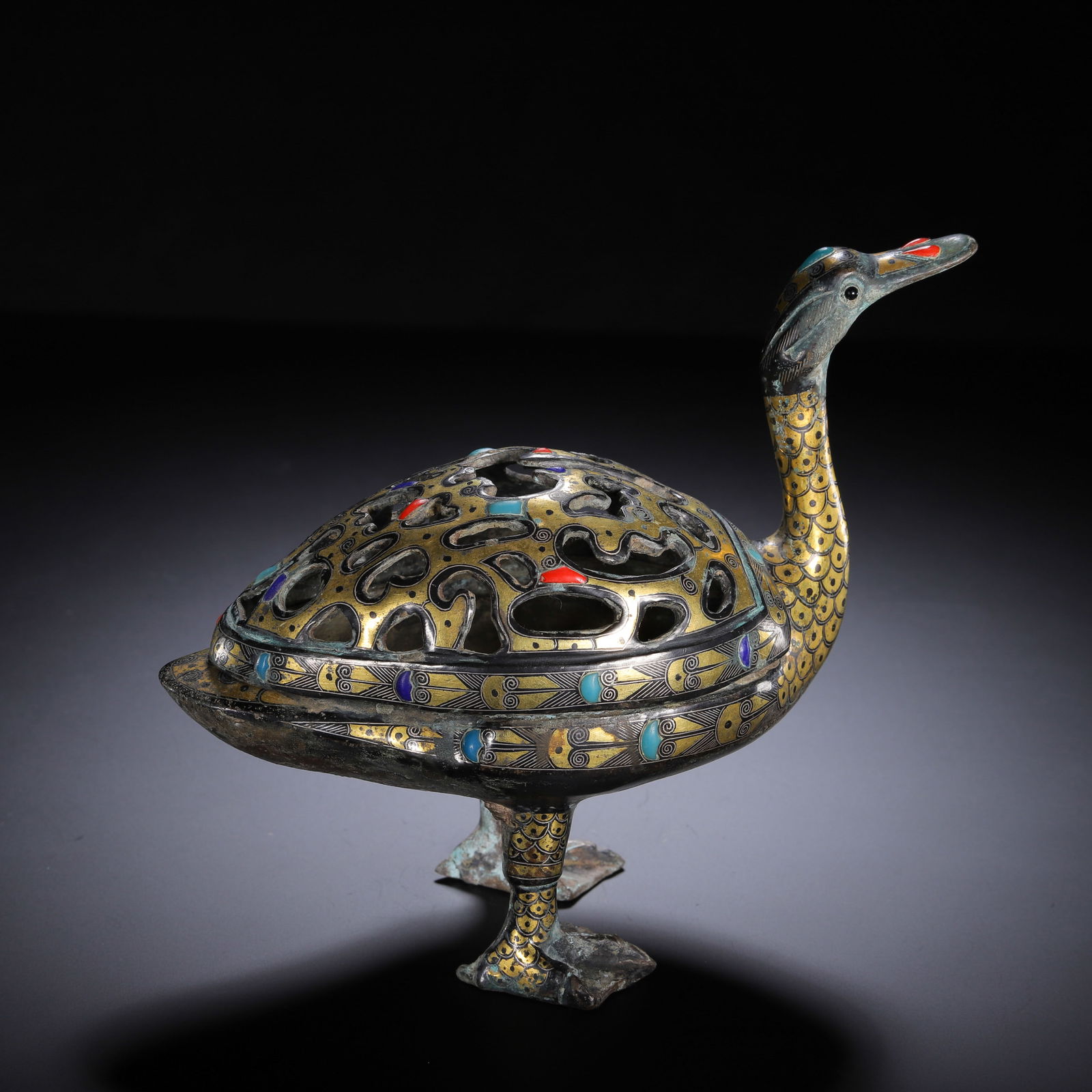 CHINESE BRONZE INLAID AUSPICIOUS BEAST CENSER: Dimensions: L. 17 cm. H. 15 cm. Weight 850 grams. This captivating Chinese bronze censer takes the form of an auspicious waterfowl-like beast, measuring 17 cm in length, 15 cm in height, and