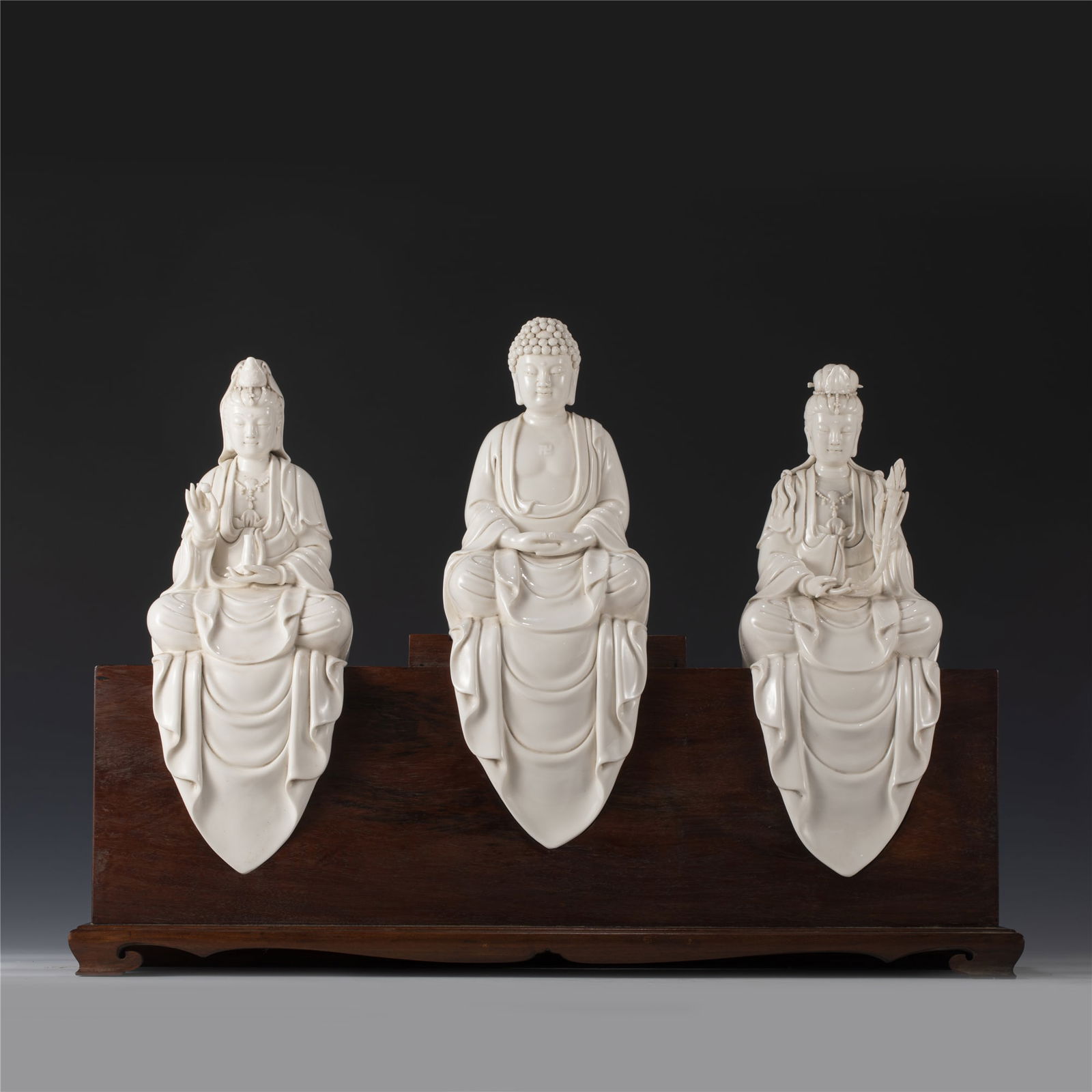SET OF 3 DEHUA PORCELAIN BUDDHAS STATUES: Measurements: Length: 13 cm, Width: 11 cm, Height: 35 cm Set of 3 Three Chinese Dehua Bodhisattvas Guanyin Statues. This statue of Buddha Guanyin potted in a Peaceful face, smiling, beautiful and yout