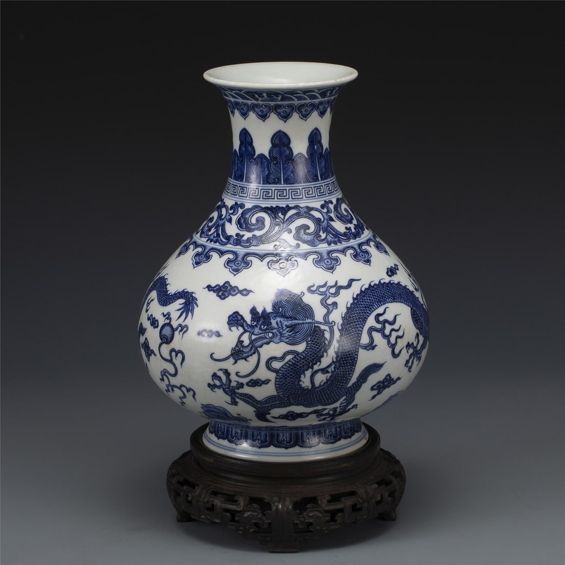 QING QIANLONG BLUE & WHITE VASE: Measurements: Width: 22 cm, Height: 29 cm Chinese Qing Dynasty Qianlong Blue and White Porcelain Jade Pot Spring Vase On Carved Hardwood Stand. This vase has a Chinese traditional YuHuChun shape vesse