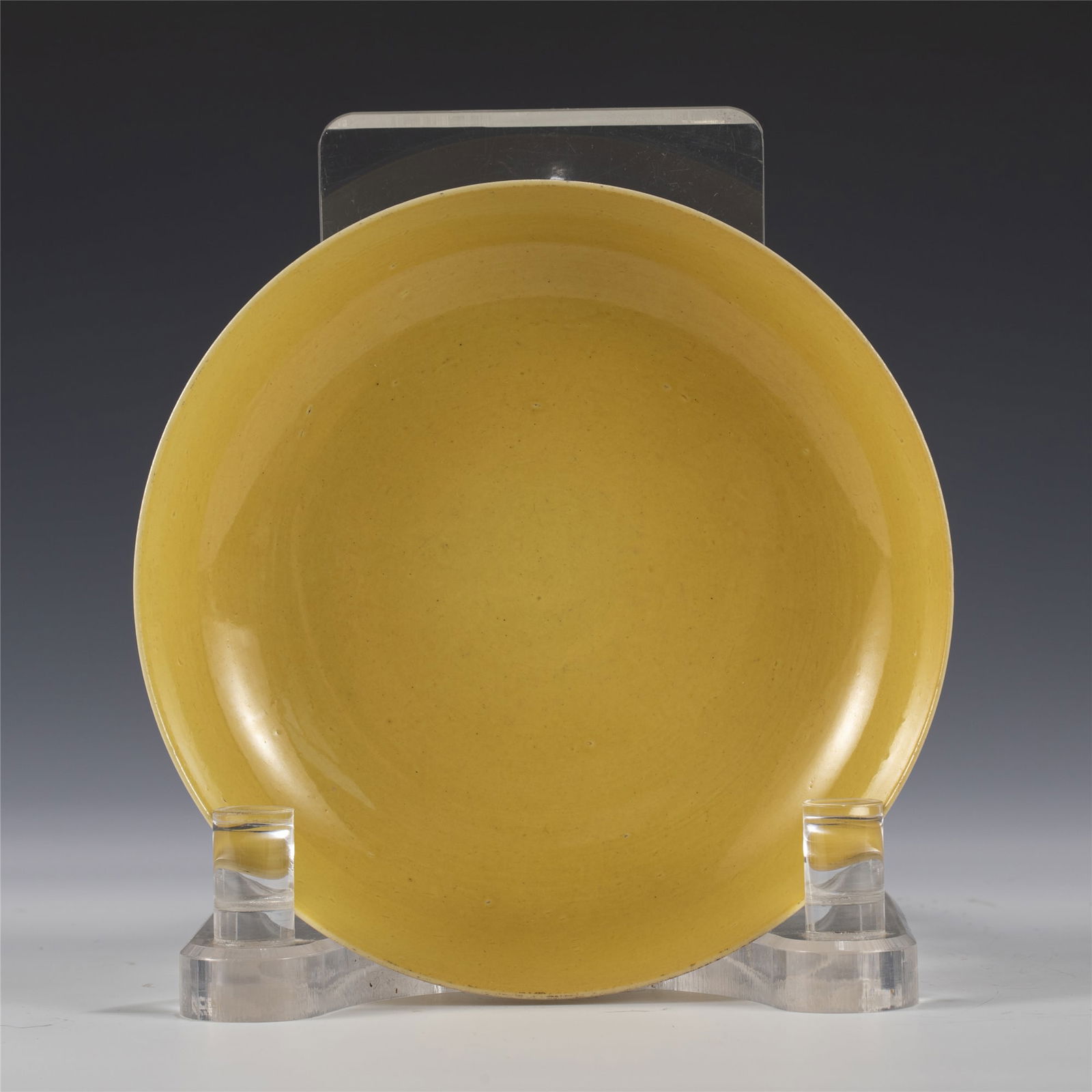 QING XIANFENG YELLOW GLAZED PLATE: Measurements: Length: 15.4 cm, Width: 15.4 cm, Height: 3.3 cm Chinese Qing Dynasty Xianfeng Yellow Glazed Porcelain Plate. The dish plate has a broad wide central interior, rounded mouth lip, thick la