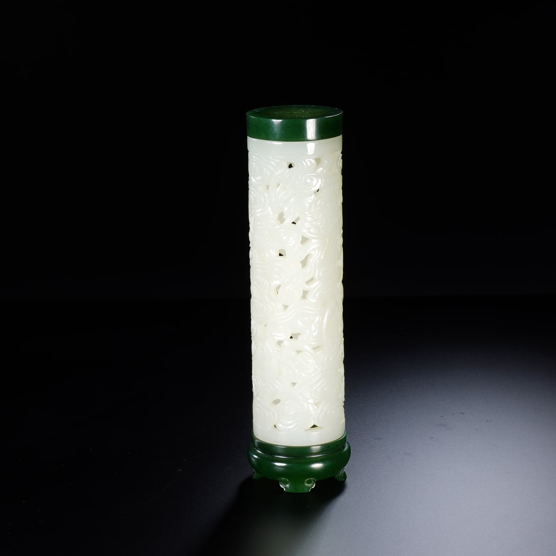 CHINESE WHITE JADE AUSPICIOUS BEAST ORNAMENT: Dimensions: 4.2x15 cm. Weight 190 grams. This Chinese white jade carving depicts a recumbent ruishou (auspicious beast) with intricately carved manes and a playful pose, set upon a zitan wood stand wi