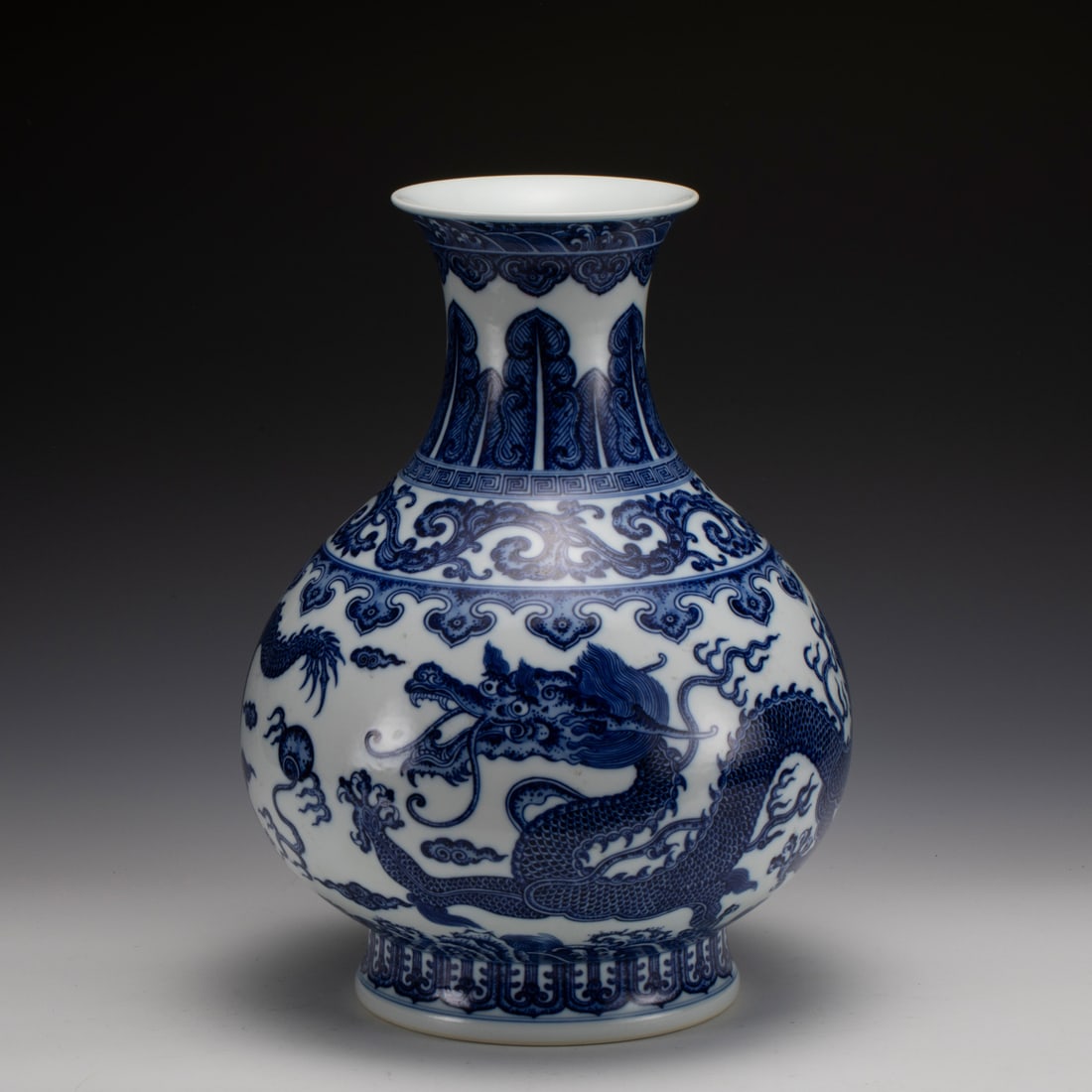 YONGZHENG BLUE & WHITE DRAGON VASE: Measurements: Width: 28.8 cm, Height: 38.2 cm Chinese Qing Dynasty Yongzheng Blue and White Dragon Porcelain Jade Pot Spring Bottle Vase. This vase has a Chinese traditional YuHuChun shape vessel, the