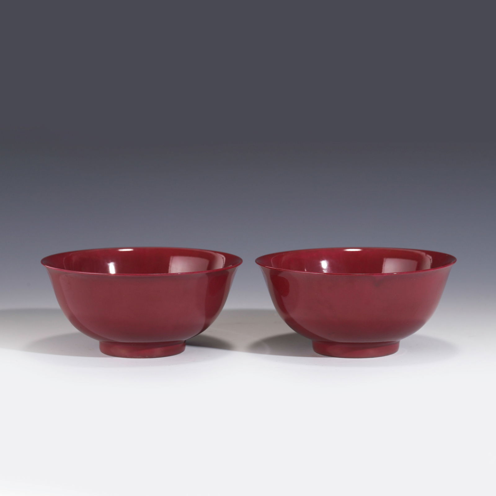 A PAIR OF PURPLE-RED GLAZE BOWLS (1 of 6)