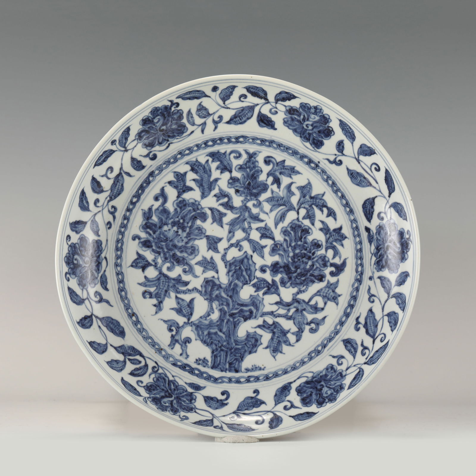 MING BLUE & WHITE FLORAL PLATE: Measurements: Height: 5.8 cm, Diam: 32.2cm Chinese Ming Dynasty Blue and White Flowers Porcelain Plate. The plates has a broad wide central interior, rounded mouth lip, thick and large, raised on