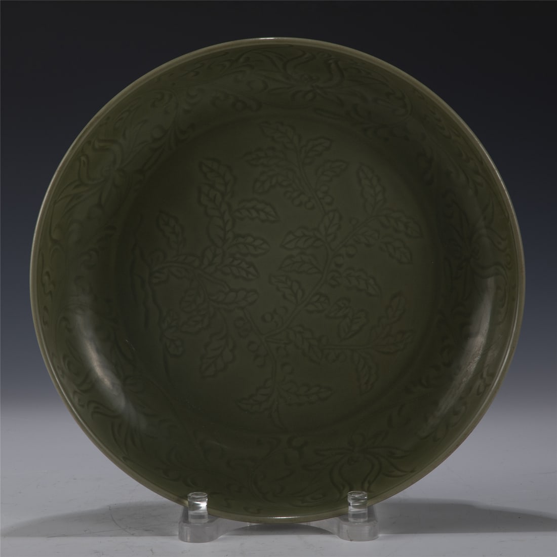 MING LONGQUAN PLATE: Measurements: Length: 37.4cm, Width: 37.4cm, Height: 6.7cm Chinese Ming Dynasty Longquan Porcelain Plate. The plate has a broad wide central interior, rounded mouth lip, thick and large, raised on