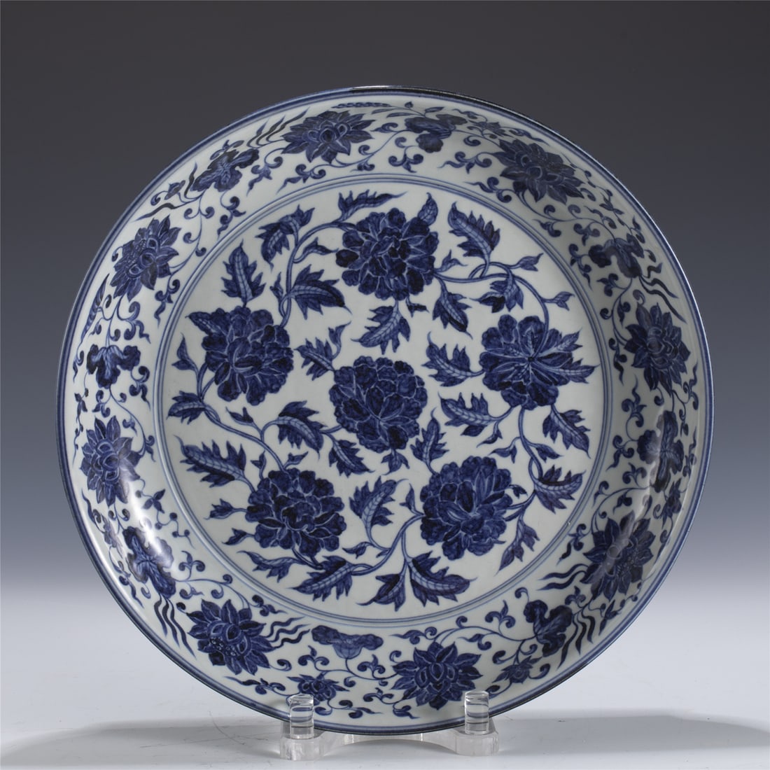 MING BLUE & WHITE PEONY PLATE: Measurements: Length: 41cm, Width: 41cm, Height: 6.8cm Chinese Ming Dynasty Blue and White Peony Porcelain Plate. The plate has a broad wide central interior, rounded mouth lip, thick and large,