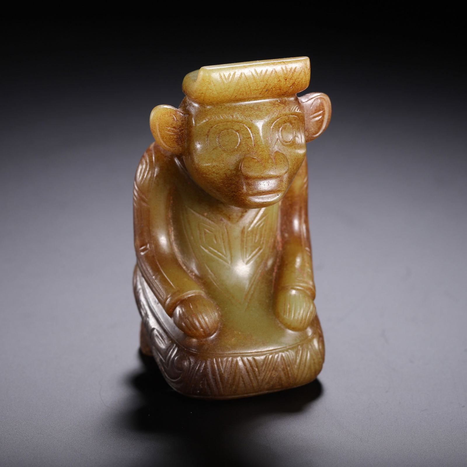 CHINESE HETIAN JADE NOBLE FIGURE: Dimensions: H. 8.5 cm. Weight 250 grams. This charming Chinese Hetian jade sculpture of a noble figure stands 8.5 cm high and weighs 250 grams, carved from warm-toned celadon jade with russet suffusio