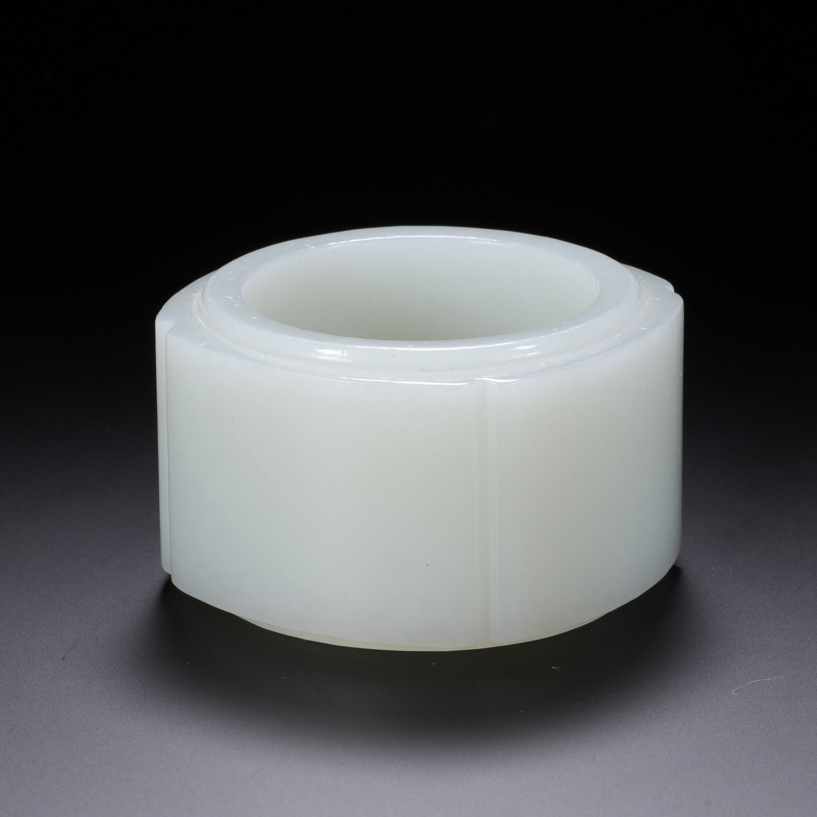 CHINESE HETIAN WHITE JADE CONG: Dimensions: H. 3.3 cm. W. 5.4 cm. This refined Chinese Hetian white jade cong measures 3.3 cm in height and 5.4 cm in width, carved from luminous, translucent white Hetian jade with a smooth, satiny f