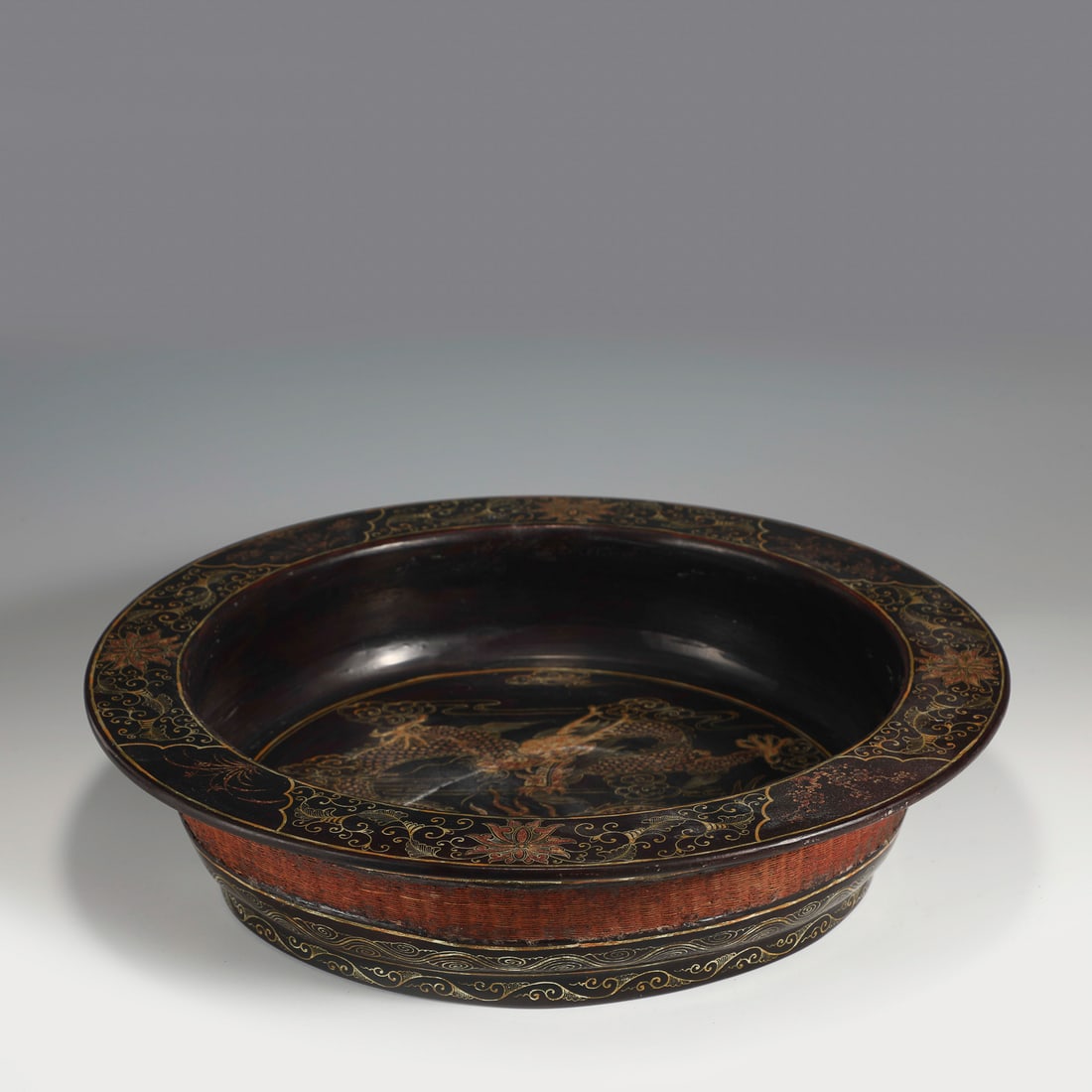 QING LACQUERED BRUSH WASHER: Measurements: Width: 43cm, Height: 10cm Chinese Qing Dynasty Lacquered Brush washer. Stoutly carved unto a shallow body, slight deep, wide flaring round rim, globular heavy on shoulder body, raised