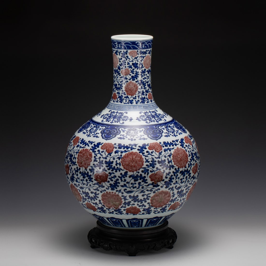 QING YONGZHENG BLUE & RED CELESTIAL VASE ON STAND: Dimensions: Width: 39.4 cm x Heigth: 54 cm Chinese Qing Dynasty Yongzheng Blue and White Underglaze Red Porcelain Sky Ball Vase On Carved Hardwood Stand. Potted in celestial sky ball vase, thick and