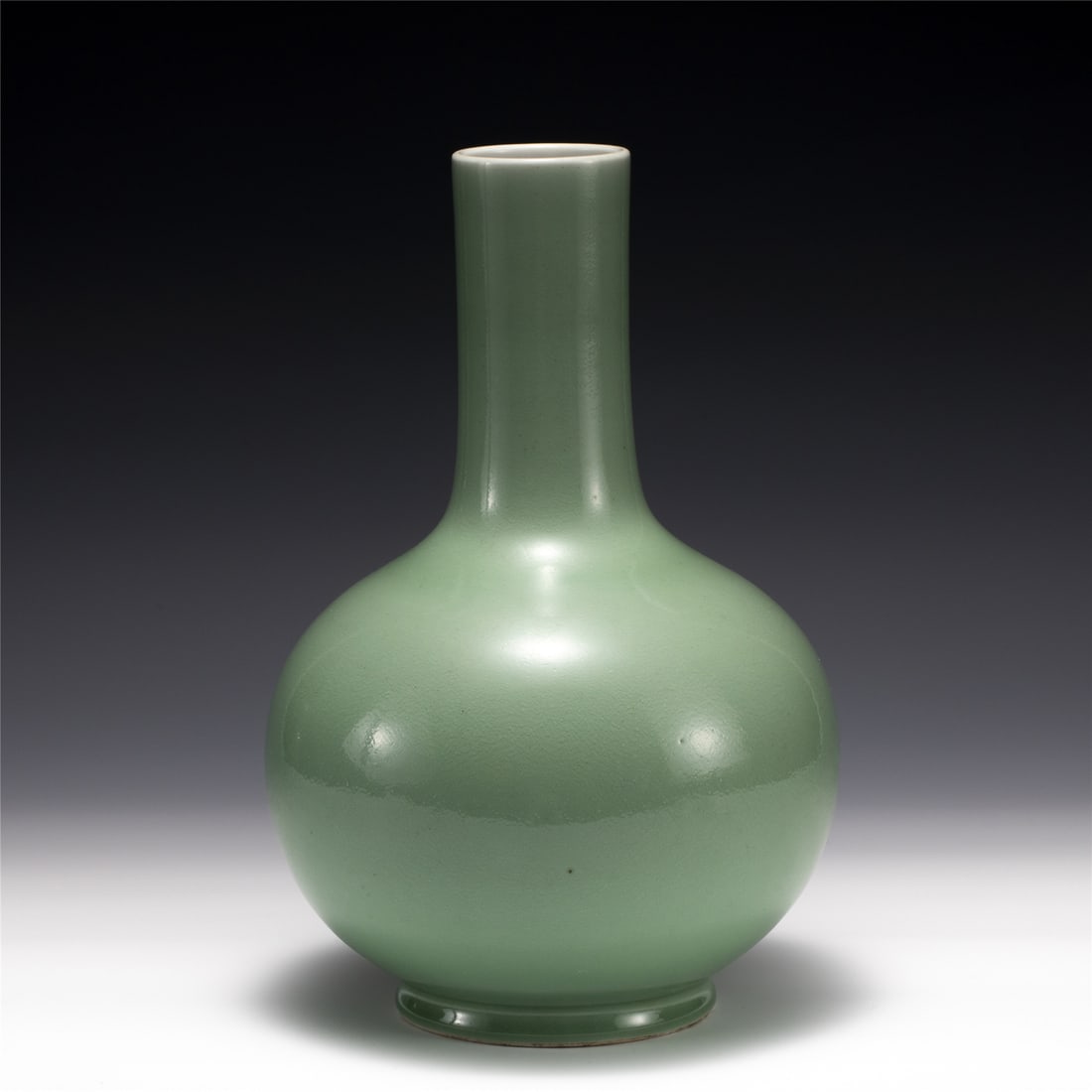 QING QIANLONG BEAN GREEN GLAZE BOTTLE: Dimensions: Width: 19.8 cm, Height: 29.5 cm Chinese Qing Dynasty Qianlong Bean Green Glazed Porcelain Bottle Vase. Potted in shape vase, thick and tall, globular lower body, cylindrical neck,