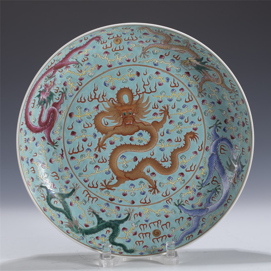 GUANGXU FAMILLE ROSE DRAGON PLATE: Measurements: Length: 40.3cm, Width: 40.3cm, Height: 7cm Chinese Qing Dynasty GuangXu Famille Rose Dragon Porcelain Plate. The plate has a broad wide central interior, rounded mouth lip, thick and