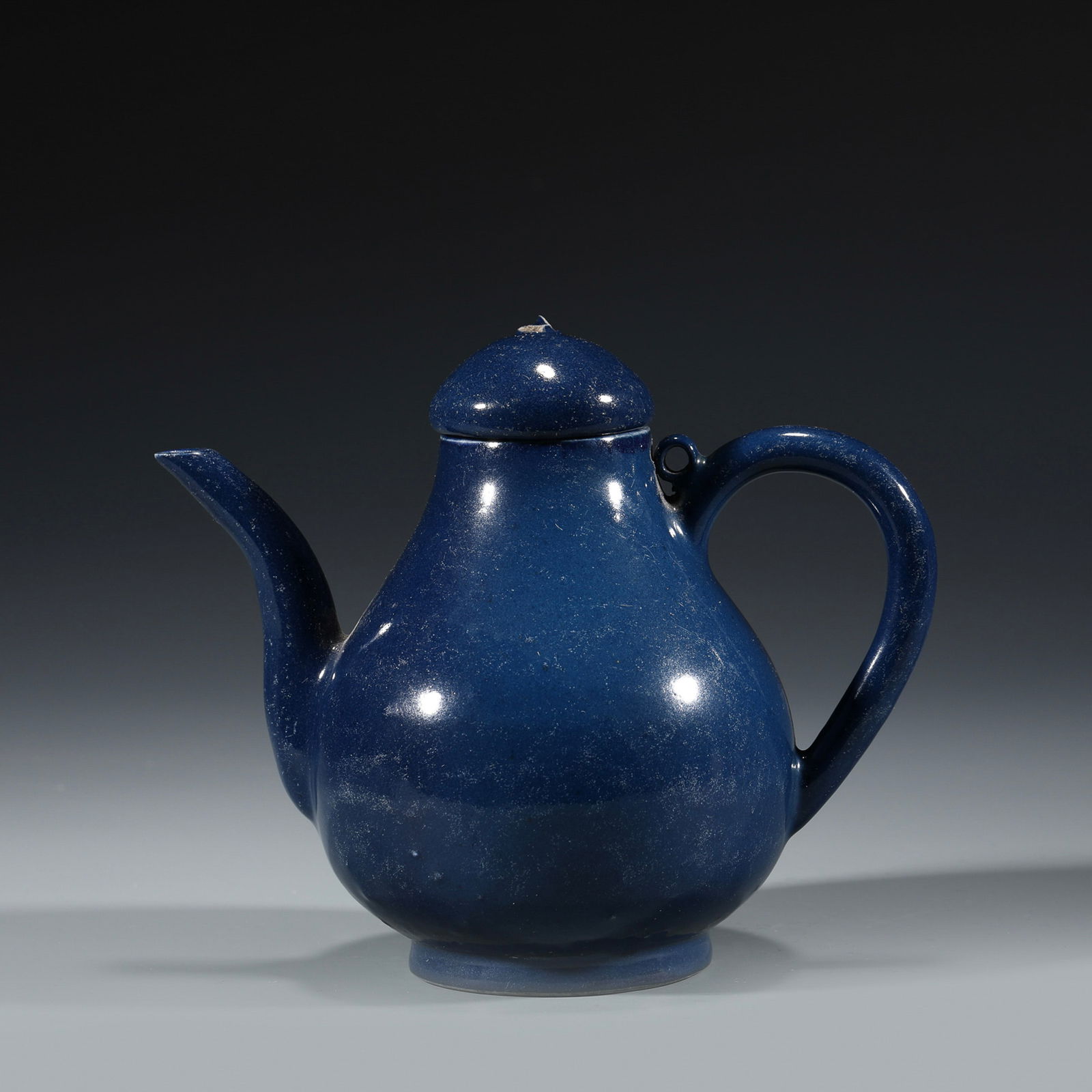 MING JIAJING JI BLUE POT: Dimensions: Length: 15cm, Width: 9cm, Height: 13cm Chinese Ming Dynasty JiaJing Ji Blue Porcelain Pot. Potted in tea pot shape, globular body with curve spout flanked on the mid belly outward at the