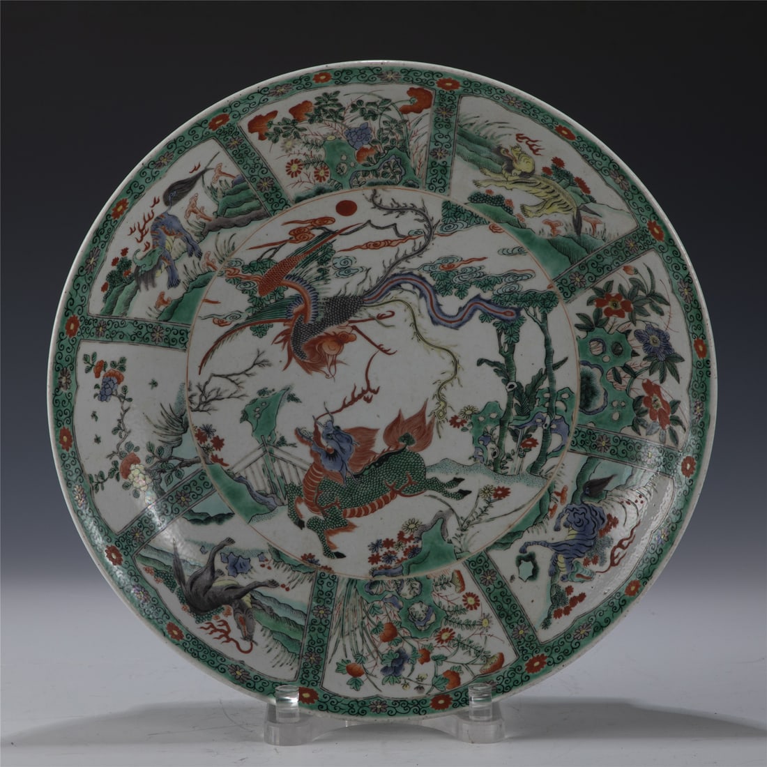 KANGXI WUCAI PLATE: Measurements: Length: 42cm, Width: 42cm, Height: 6.8cm Chinese Qing Dynasty KangXi Wucai Qilin Porcelain Plate. The plate has a broad wide central interior, rounded mouth lip, thick and large,