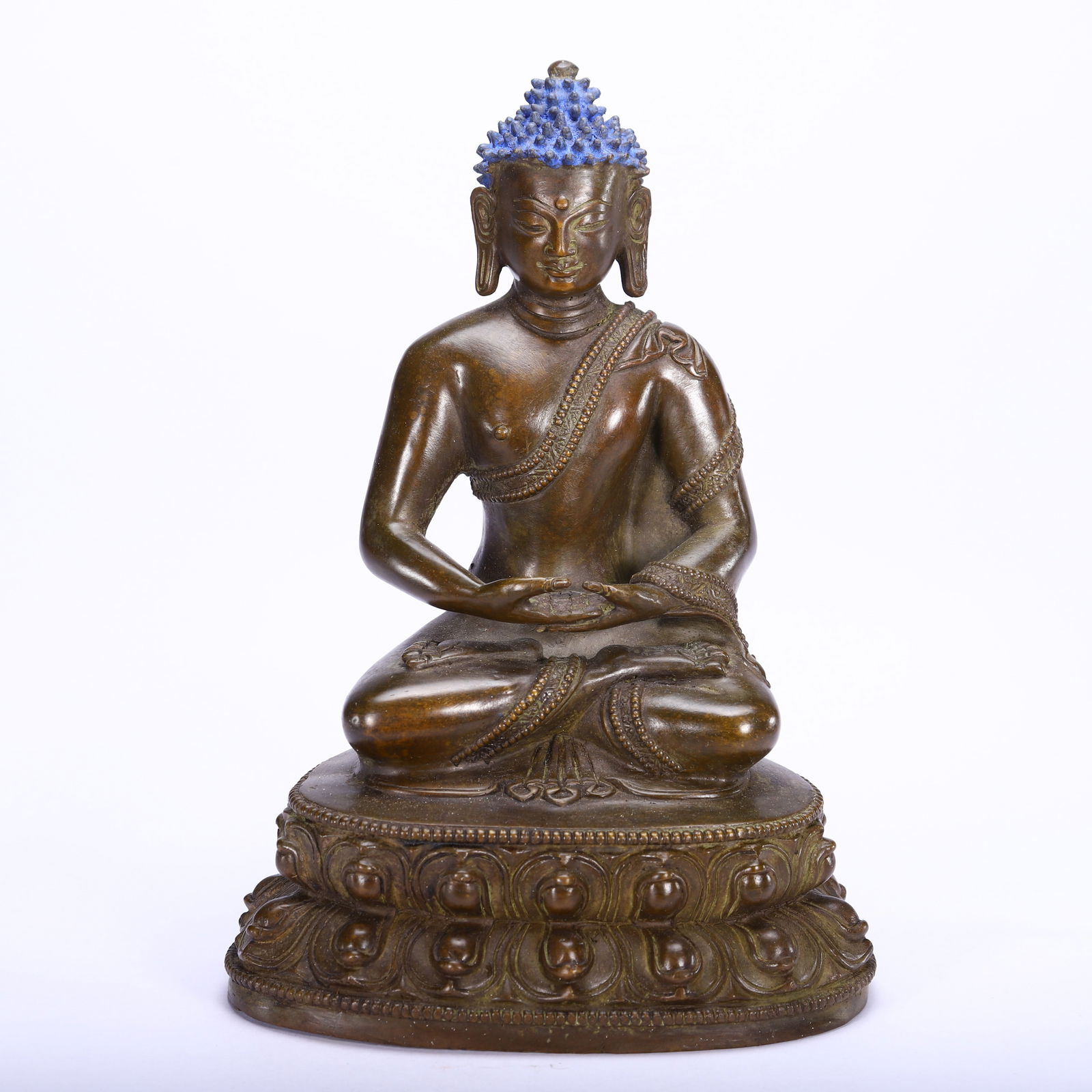 CHINESE BRONZE SAKYAMUNI BUDDHA: Dimensions: H. 18 cm. Weight 1320 grams. This serene Chinese bronze Sakyamuni Buddha stands 18 cm high and weighs 1,320 grams, depicted in the classic lotus position (padmasana) on a double lotus base