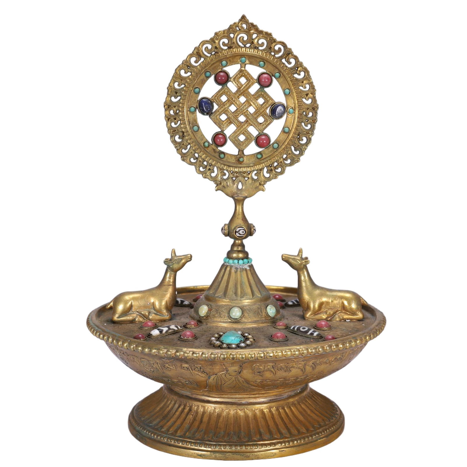 CHINESE GILT BRONZE RITUAL VESSEL: Dimensions: L. 23 cm. W. 23 cm. H. 35 cm. Weight 2840 grams. This elaborate Chinese gilt bronze ritual vessel features a wide bowl base carved with figural motifs, flanked by recumbent deer and surmou