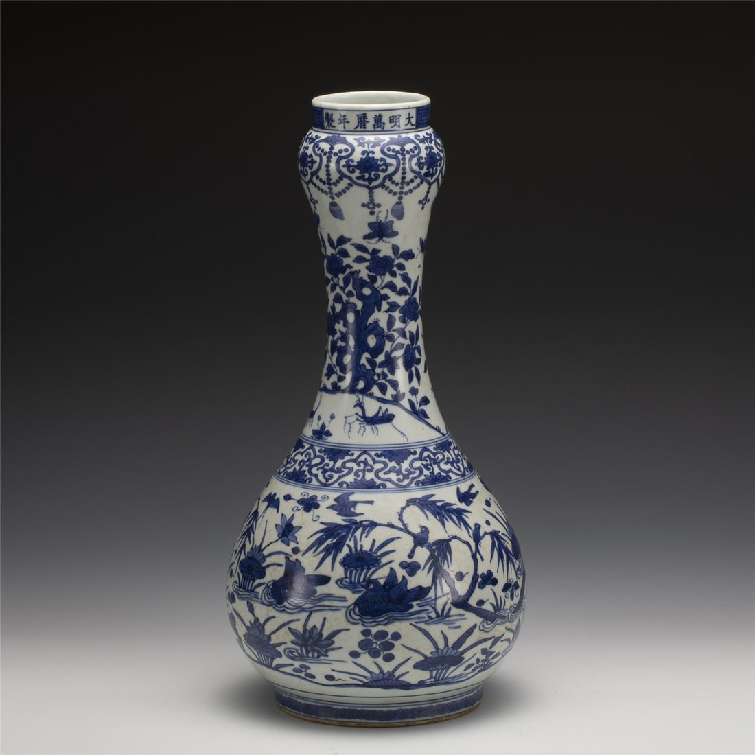 MING WANLI BLUE & WHITE GARLIC VASE: Measurements: Length: 19.5 cm, Height: 40 cm Chinese Ming Dynasty Wanli Blue and White Duck Porcelain Garlic Bottle Vase. Potted in garlic bottle shape, bulbous lower belly, thick, with rounded should