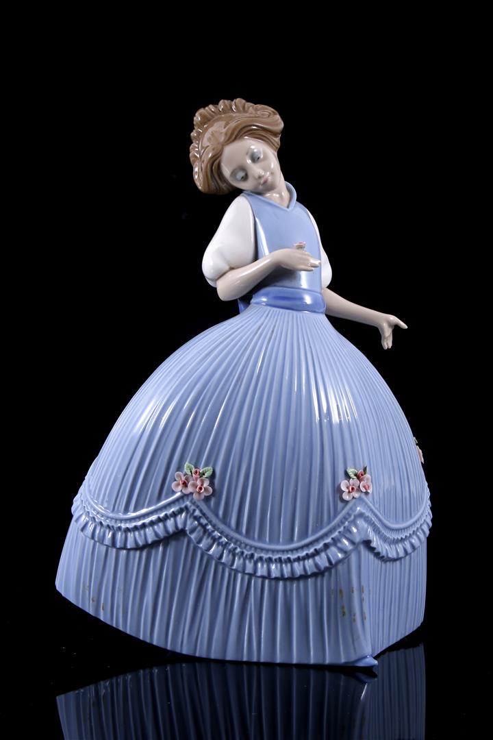 Lladro porcelain sculpture no.5119, Girl in Bluish: Lladro porcelain sculpture no.5119, Girl in Bluish Dress, Primavero no. 2, design Jose Puche, period 1982-1985, 27 cm high (1 petal damaged)