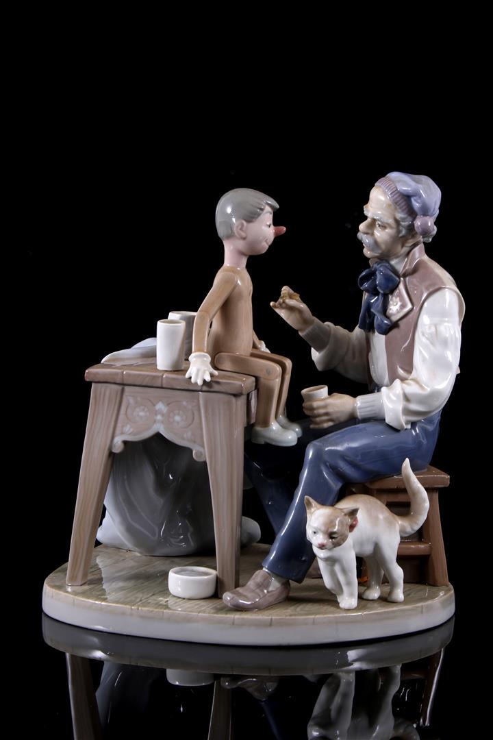 Lladro porcelain sculpture no.5396, The Puppet Painter: Lladro porcelain sculpture no.5396, The Puppet Painter, Decorando a Pinocho, design Salvador Furio, period 1986-2005, 24 cm high & nbsp; (brush in hand flaw)