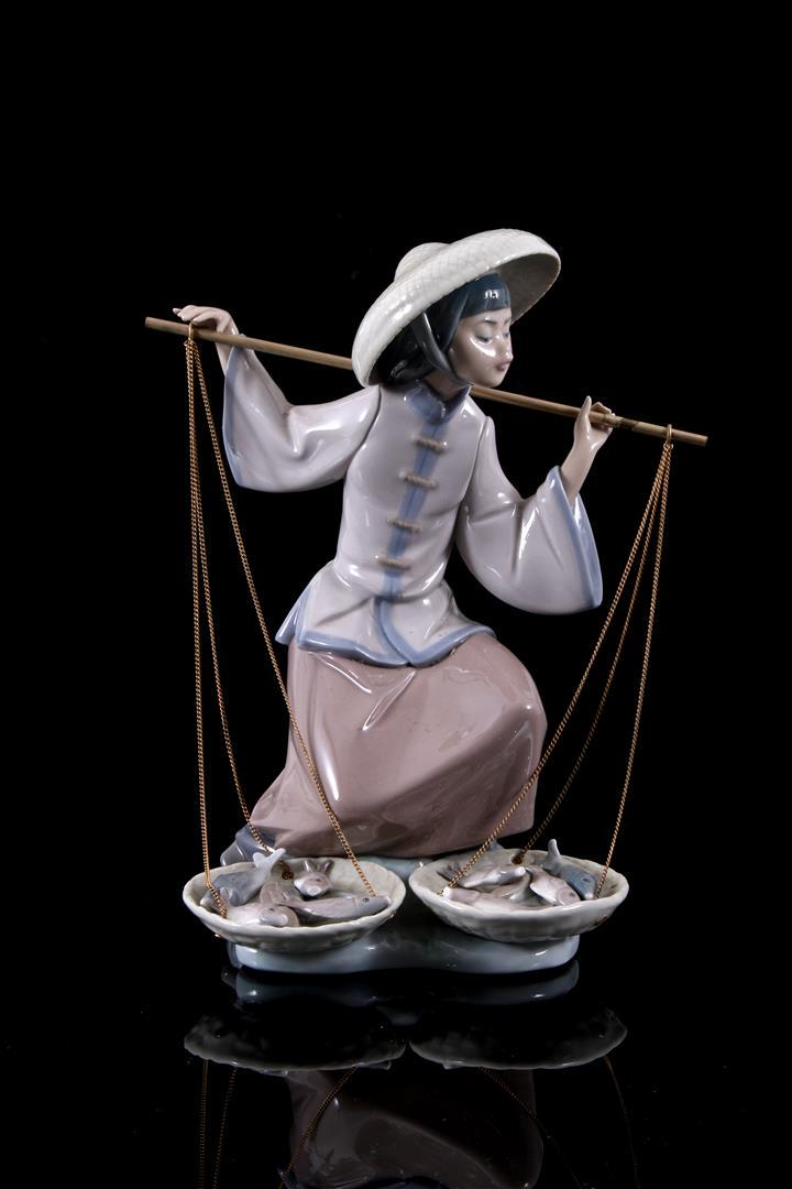 Lladro porcelain sculpture no. 5172, Fish a Plenty: Lladro porcelain sculpture no. & Nbsp; 5172, Fish a Plenty, Chinita En El Mercado, design Salvador Debon, period 1982-1994, 25 cm high