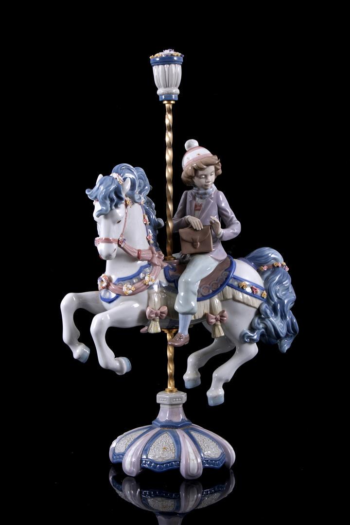 Lladro porcelain sculpture no. 5732, Carousel Canter: Lladro porcelain sculpture no. 5732, Carousel Canter, Nino En Caballito Feria, design Jose Puche, period 1991-1994, 41 cm high (damage to the flower top)