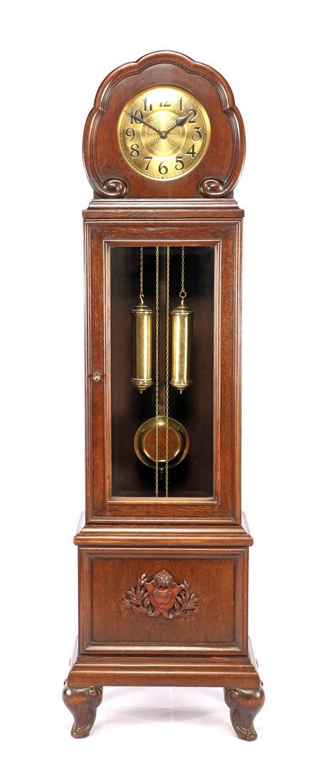 Art Deco grandfather clock in oak case with facet cut: Art Deco grandfather clock in oak case with facet cut glass in door and ornament on front 195 cm high, 59 cm wide, 34 cm deep